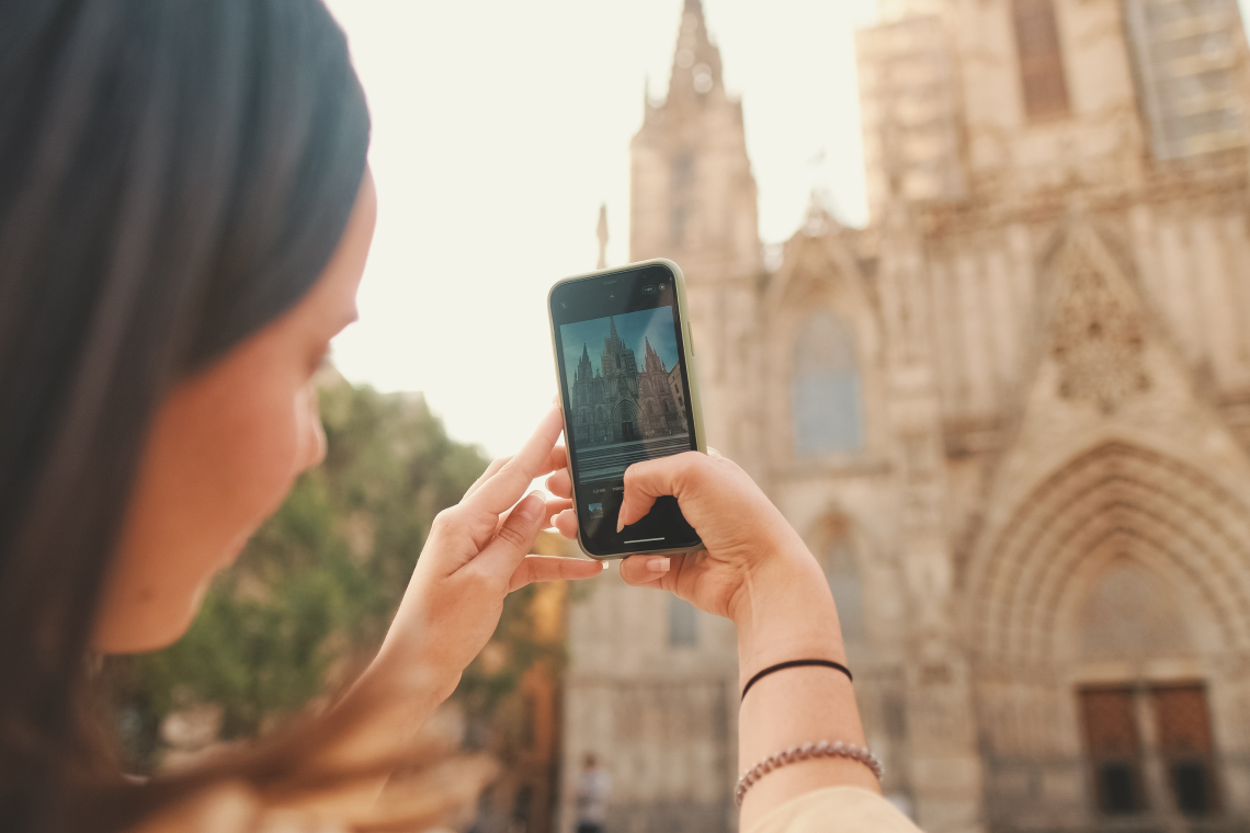 A girls taking pictures of the cathedral
