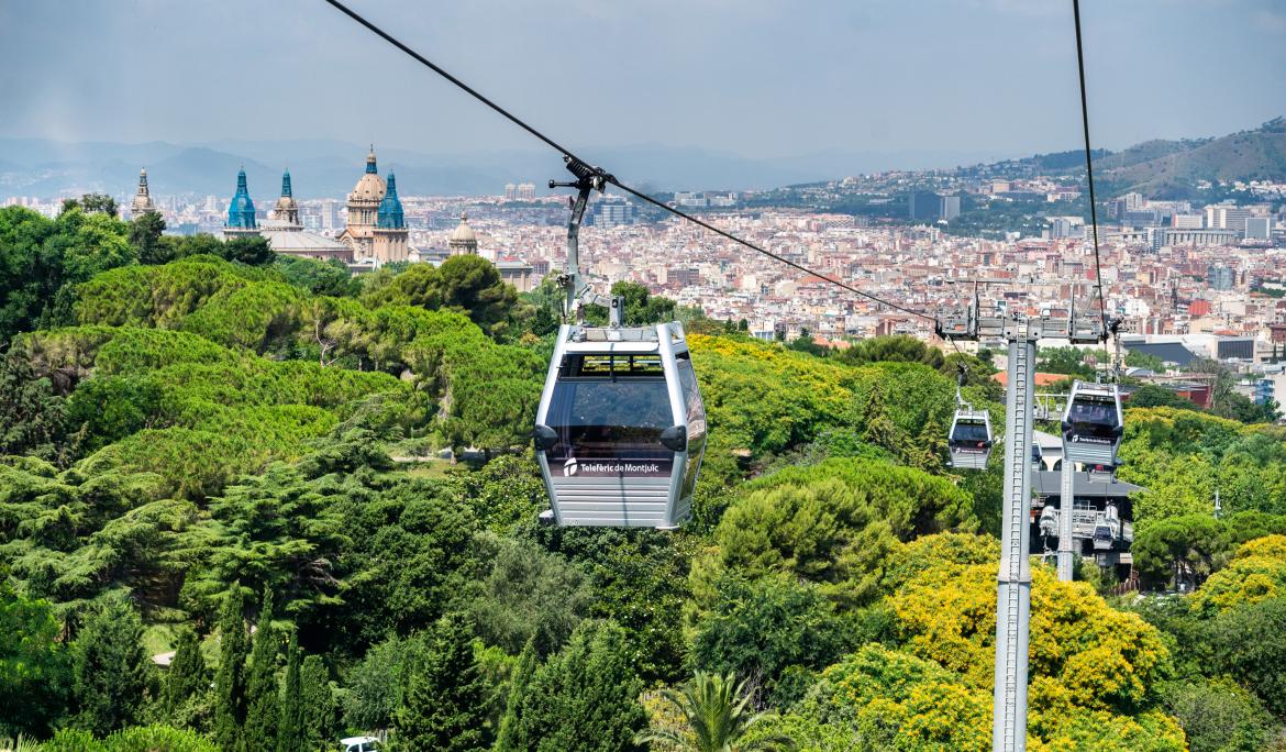 To go up to Montjuïc and enjoy the panoramic views of Barcelona, you can take the Montjuïc Cable Car