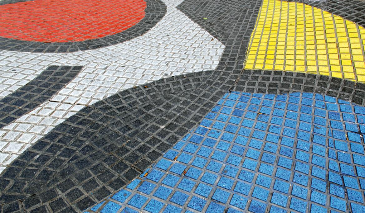 A close-up of the vibrant black, white, blue, red, and yellow mosaic on La Rambla—an essential stop for anyone seeking Joan Miró’s legacy in Barcelona