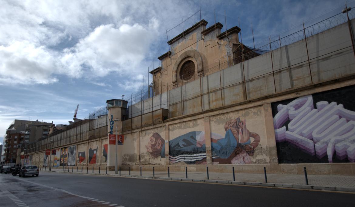The exterior of La Model, Barcelona’s former prison, now shows a façade covered in graffiti — many of them created for 8M in Barcelona.