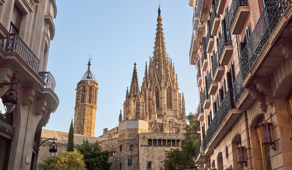 Image of a Barcelona street where the cathedral is perfectly framed.
