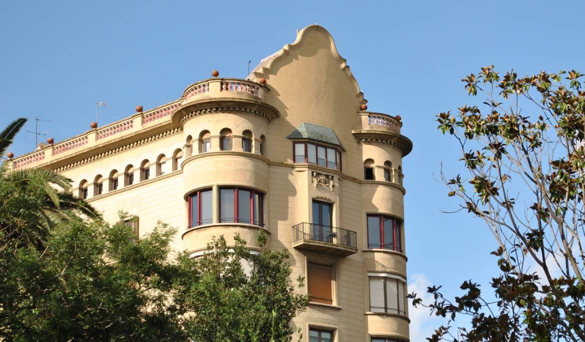 Image showcasing impressive interior architectural details of a historic Barcelona building.