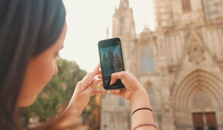 A girls taking pictures of the cathedral